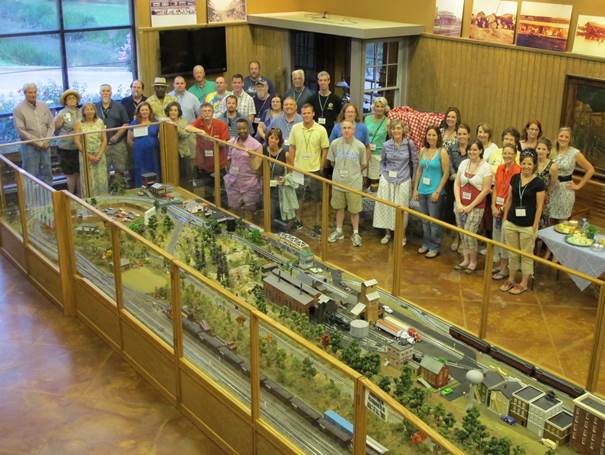 Photo: The opening reception of The Most Southern Place workshop, in the Martin and Sue King Railroad Museum.  Photo by Rachel Anderson.  