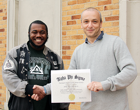 Dr. Lee welcomes Mr. Christian into the Criminal Justice Honors Society