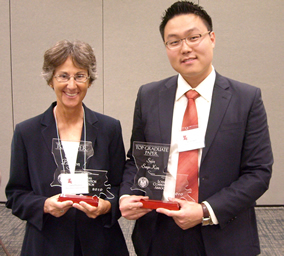 Paulson (at left), is pictured with Sejin Kim, a student at Tulane University,  who won the best paper by a graduate student.  