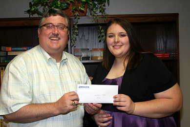 Dr. Billy Morehead (left) presenting the 2010-2011 Mississippi Society of CPA's education scholarship to Katie Stroup (right).