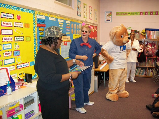 From left, Winford, Canady, as Terrance the rat, Wheezy Bear and Ruby Hall, school nurse for West Bolivar Elementary School, shared information about the effects of smoking and asthma management with a kindergarten class at the school. 