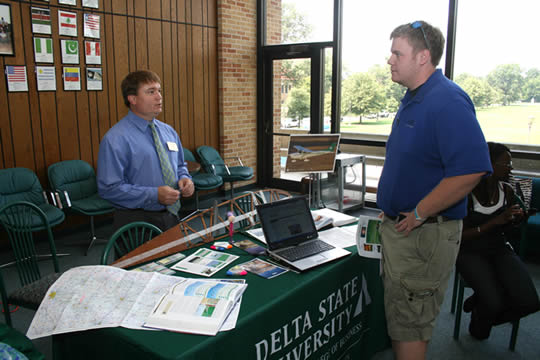 Bret Oleis, (left) instructor in Commercial Aviation, talks with Delta State student Matt Holloway of Birmingham, Alabama