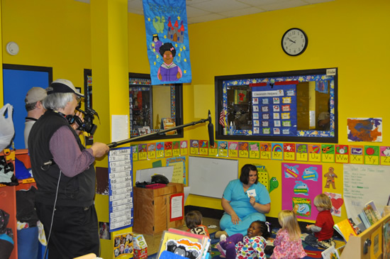 Front from left, Project coordinator, Jeff Leffler, with MSU Television Center members, filmed Kelly Cosby ( teacher) with students in the three-year old classroom at the Child Development Center. 