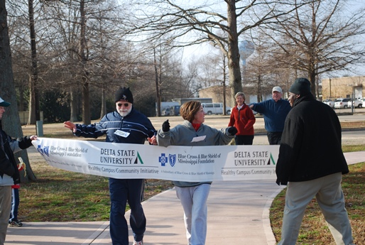 Bill and Debbie Powell of Cleveland cross the finish line during last year’s Healthy Campus/Community one mile fun run.