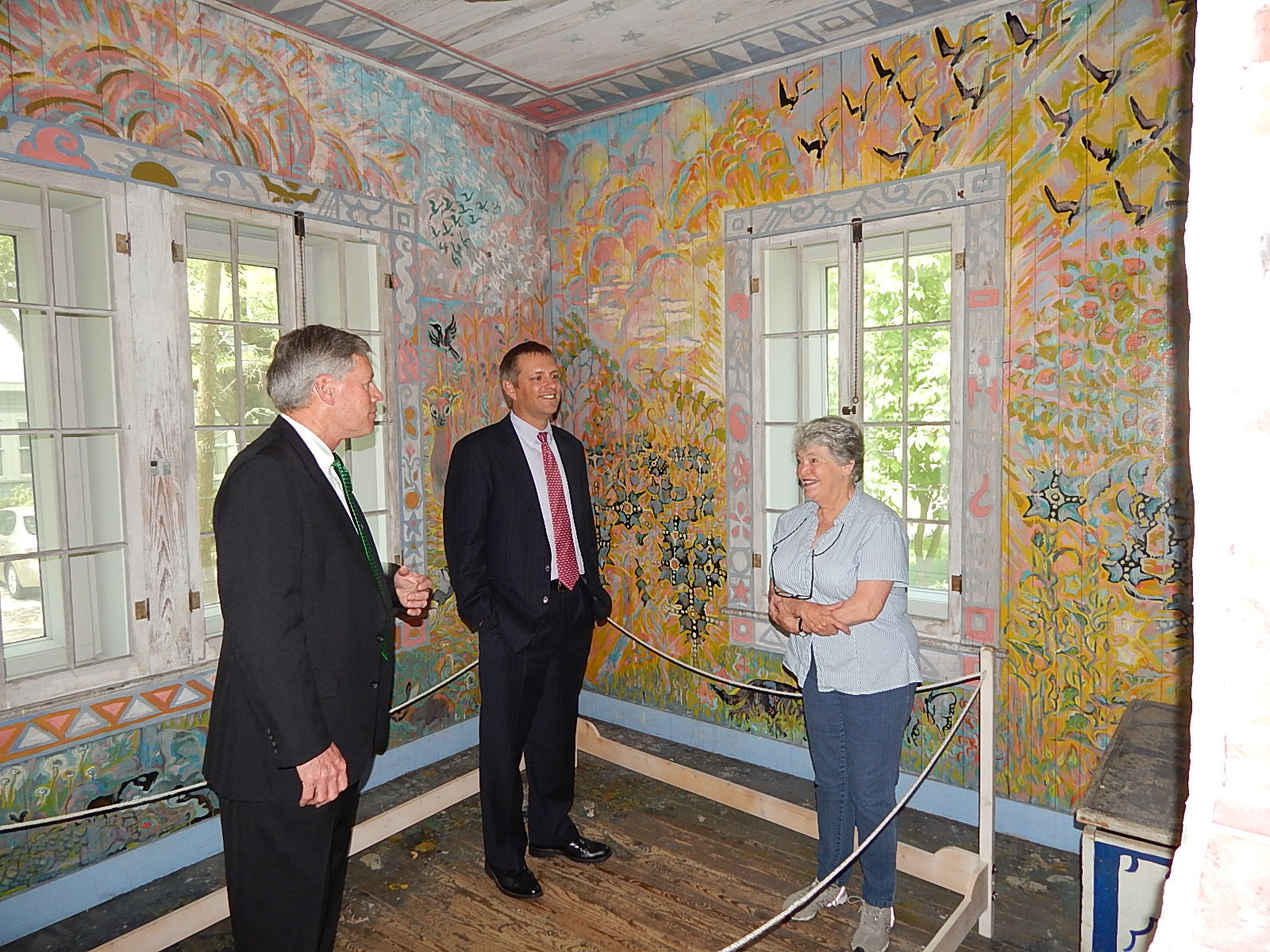 PHOTO:  President William N. LaForge and Richard Myers enjoy a tour given by Mary Anderson Pickard. 
