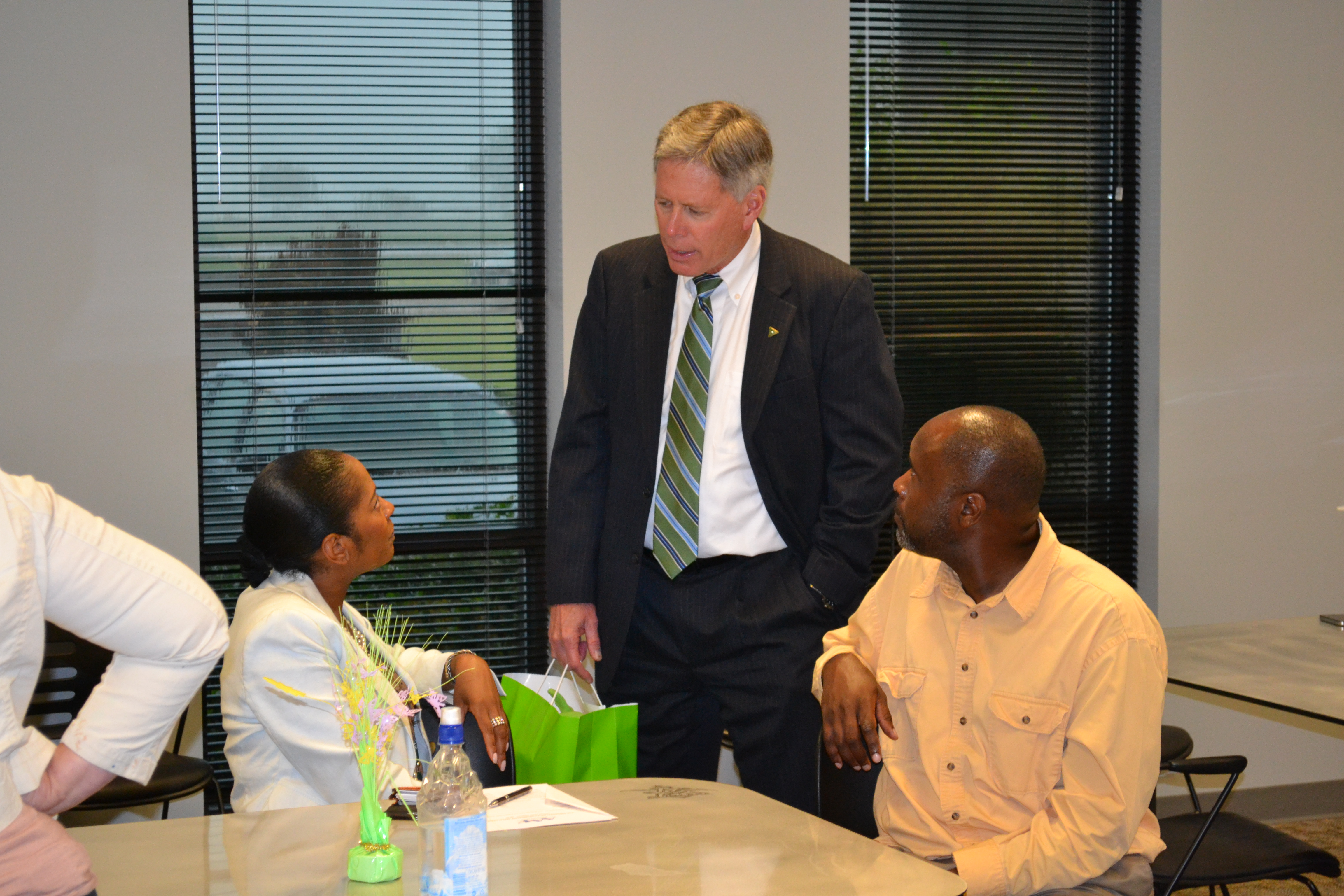 Photo: President LaForge speaks with Mississippi Valley State University Interim Director Jennifer Freeman and Senior Graphic Designer John McCall.