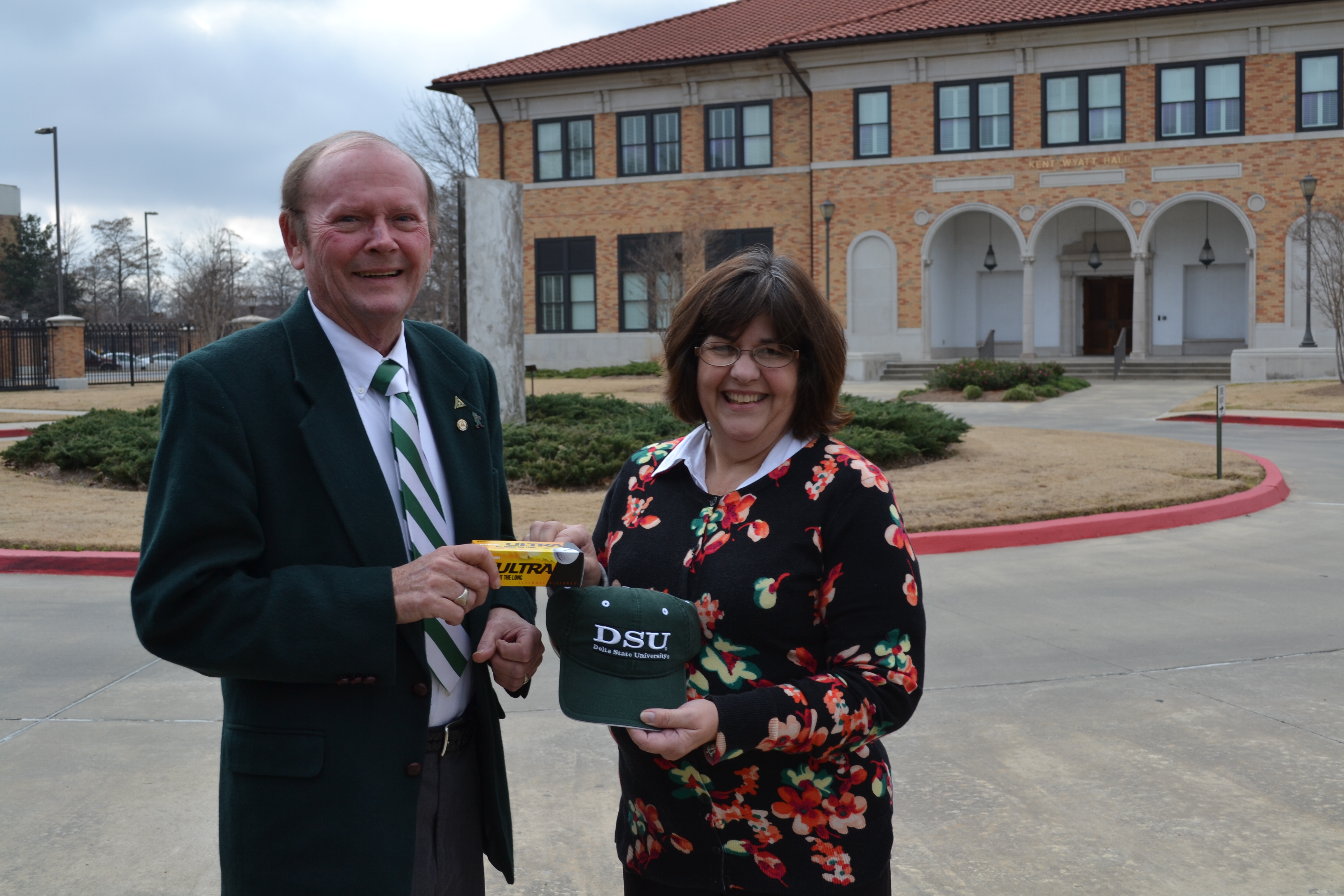 Photo: Anne Wynn Weissinger, President of the Delta State University Foundation Board of Directors, presents Delta Regional Foundation Board member, James Donald Cooper, with a Delta State University cap and logo golf balls in appreciation of grants from Delta Regional Foundation totaling $72,000 over the past two years. 