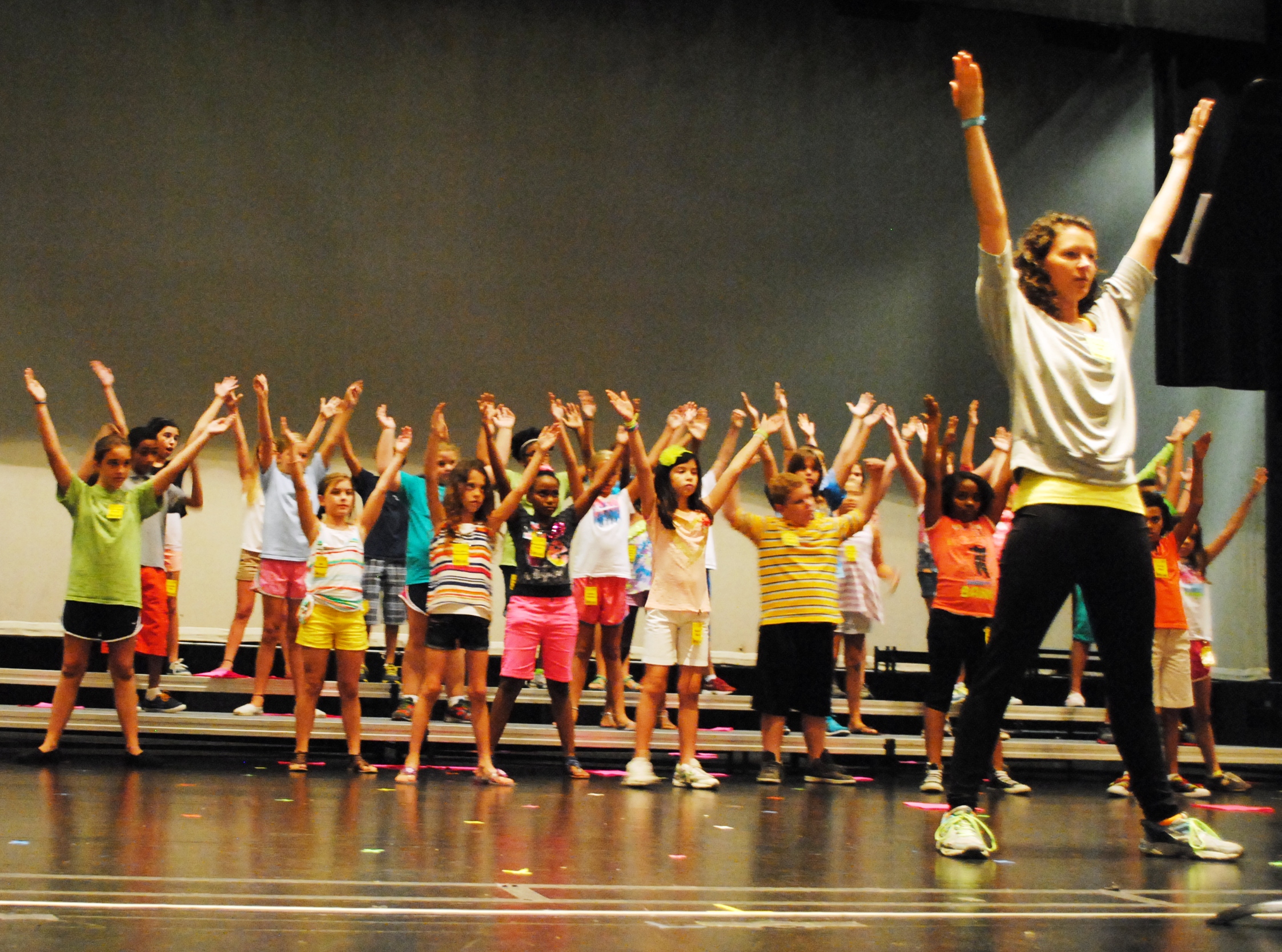 Caption: Mandy Bell, PLUS Camp Choreographer, leads the campers in part of their routine for the final performance on Saturday.