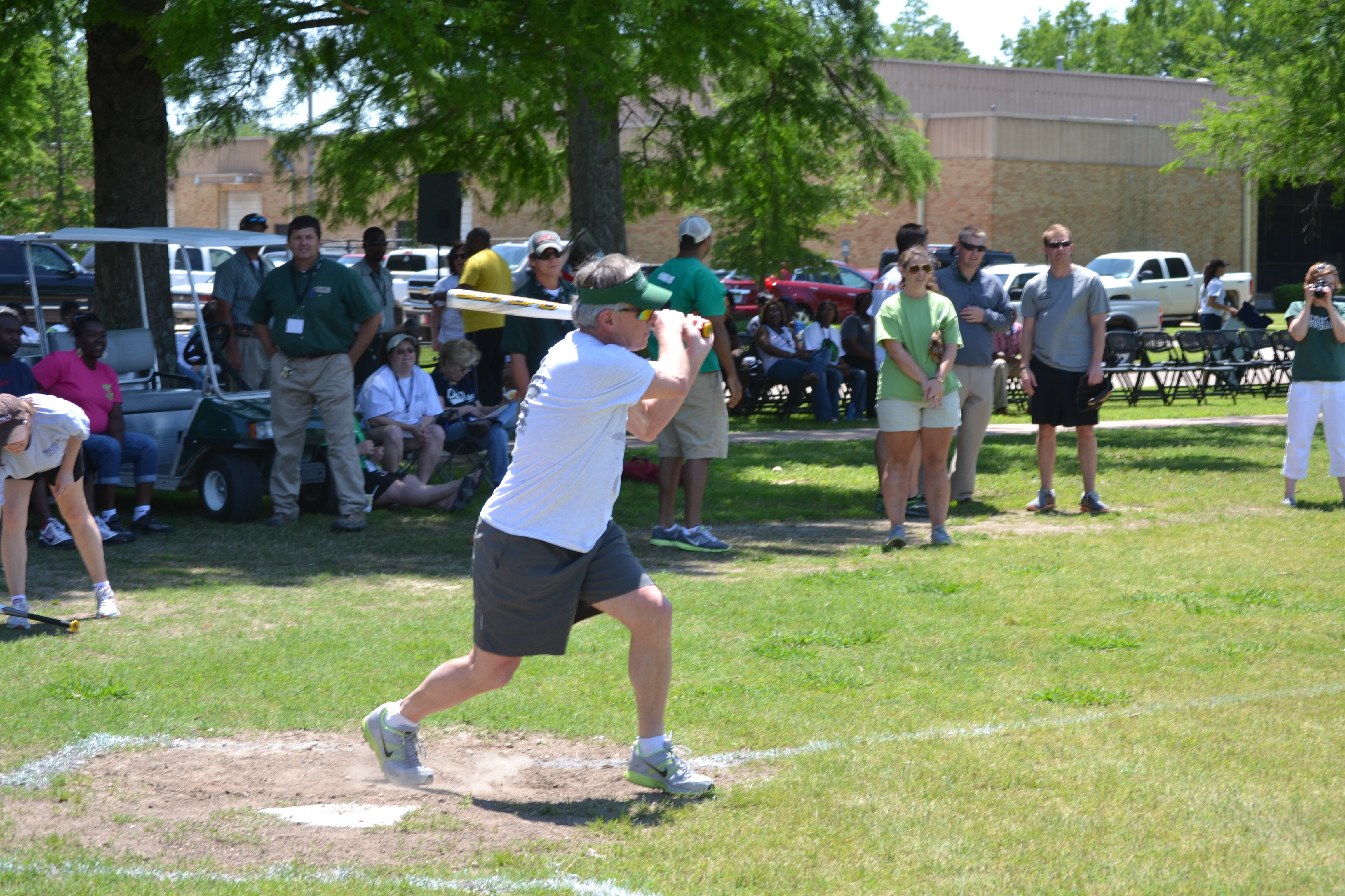 Photo: President William N. Laforge participating in a game of softball on the intramural fields at the Delta State Fitness Trail...