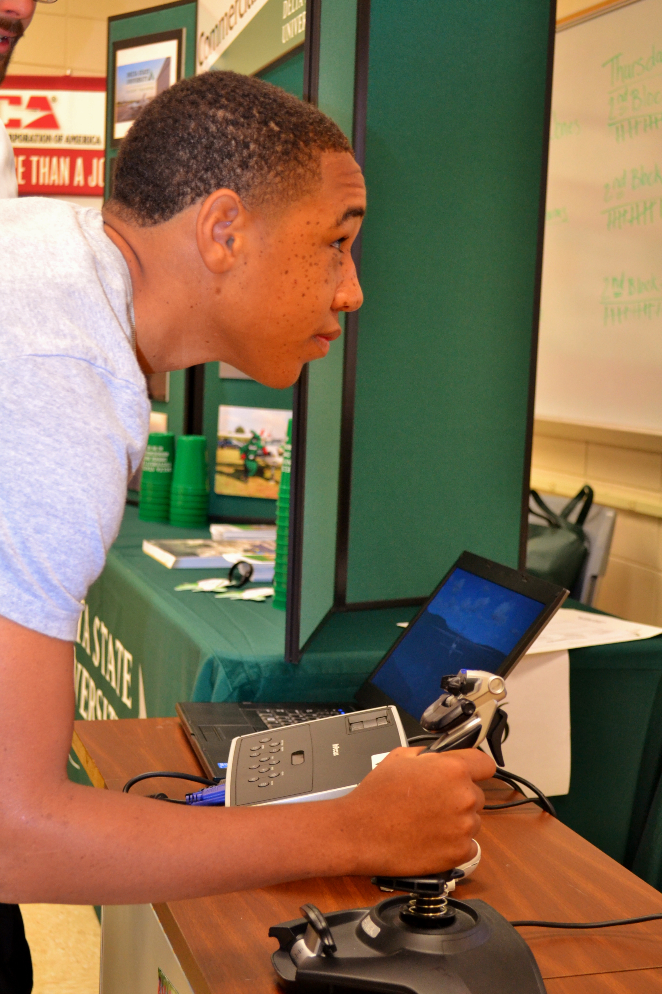 Photo: Student flies planes using the Delta State Commercial Aviation flight simulator. 