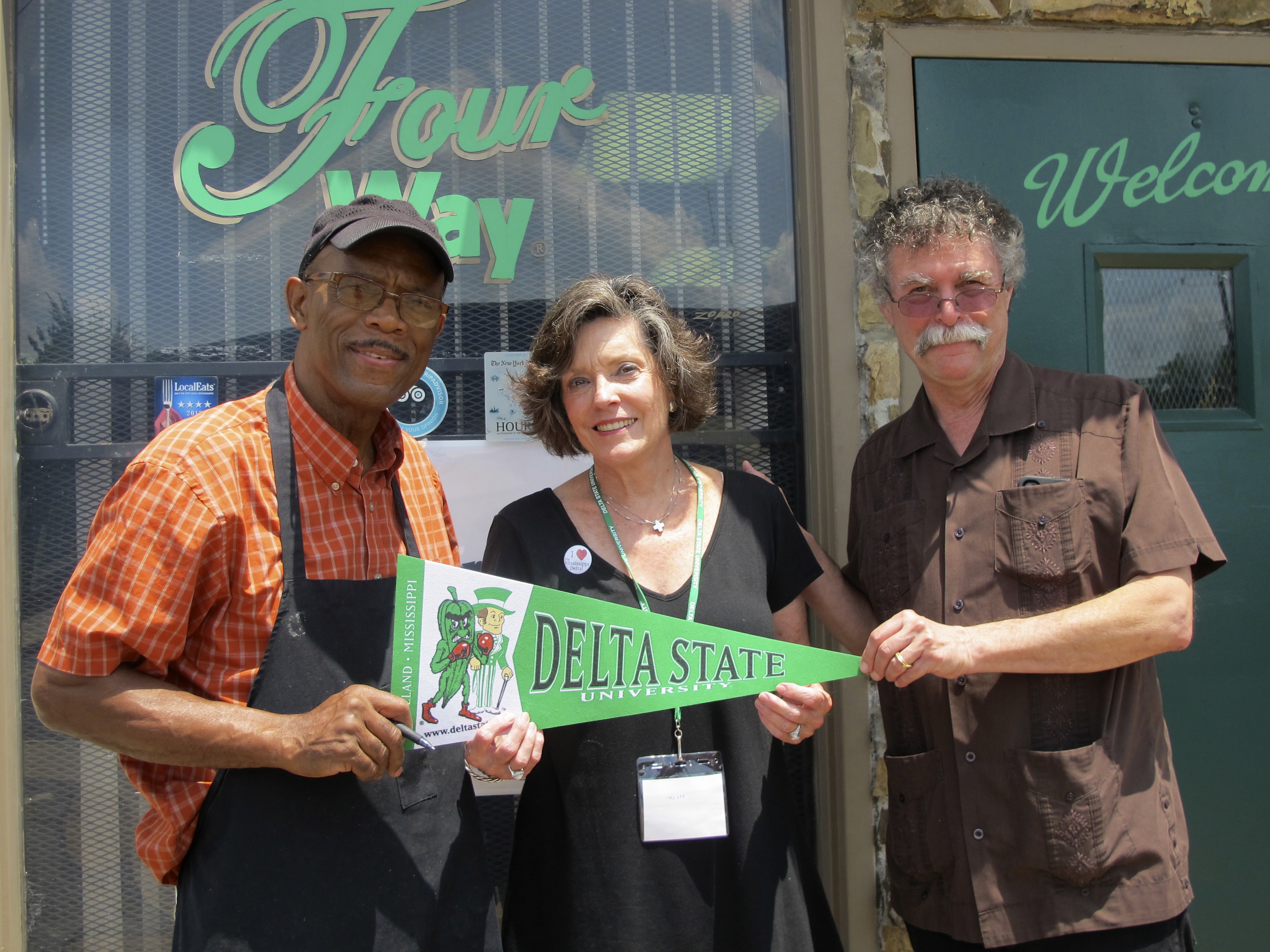 Photo: Restaurateur Willie Bates and the Delta Center’s Lee Aylward and Luther Brown in front of the Four Way Grill, 998 Mississippi Blvd, Memphis, TN 38126.  Photo by Rachel Anderson.