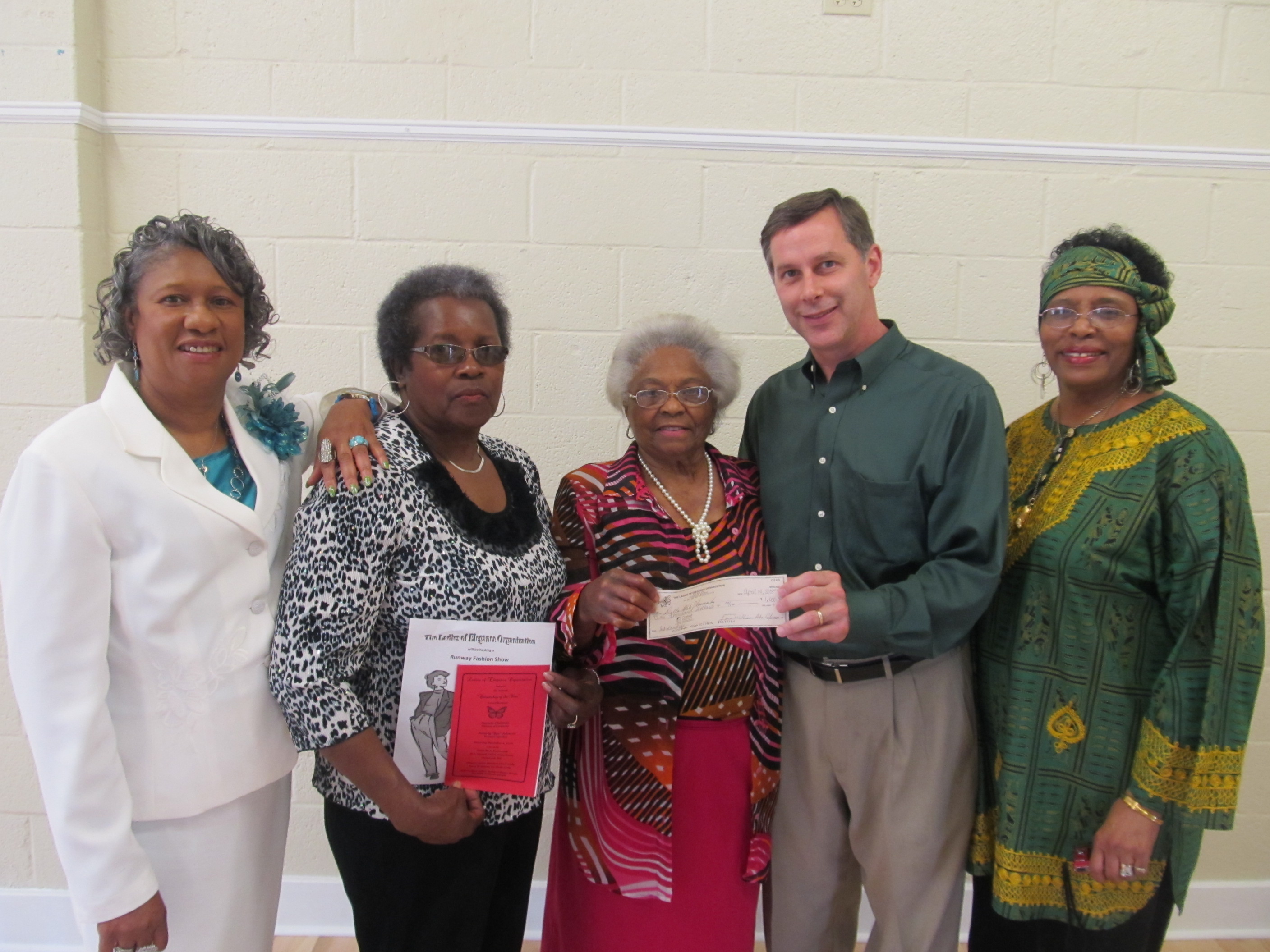 Photo: Lady Helen Coleman (center), Founder and CEO of the Ladies of Elegance Organization (LEO), presents a $1,000 check for the newly initiated Ladies of Elegance Annual Scholarship to Keith Fulcher, Executive Director of Alumni-Foundation at Delta State University.   
