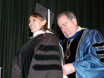 Natasha Trethewey is hooded by Delta State University President John Hilpert during the 2007 Fall Commencement Ceremony.