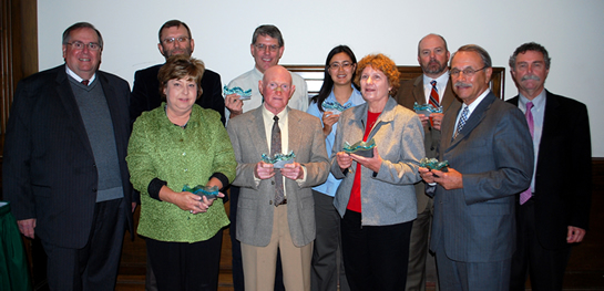 Front row: Diane Makamson, President of the Cleveland Bolivar Country Chamber of Commerce; Fred Ballard, President of the Mississippi Levee Board; Linda Smith, Delta State Facilities Management; and Dr. Edgar King, Executive Director of the Jamie Whitten Delta States Research Center.  Back row: John Hilpert, President of Delta State; Dean Pennington, Executive Director of the Yazoo Mississippi Delta Joint Water Management District; Alan Barton, Vice President of The Friends of Dahomey National Wildlife Refuge, Michelle Johansen, Manager, Cleveland Farmers Market; Bill Sheppard, Assistant Chief Engineer, Yazoo Mississippi Delta Joint Water Management District; and Luther Brown, director of Delta State’s Delta Center for Culture and Learning.  Not pictured: Garry Jennings, director of the Delta State Madison Center. 