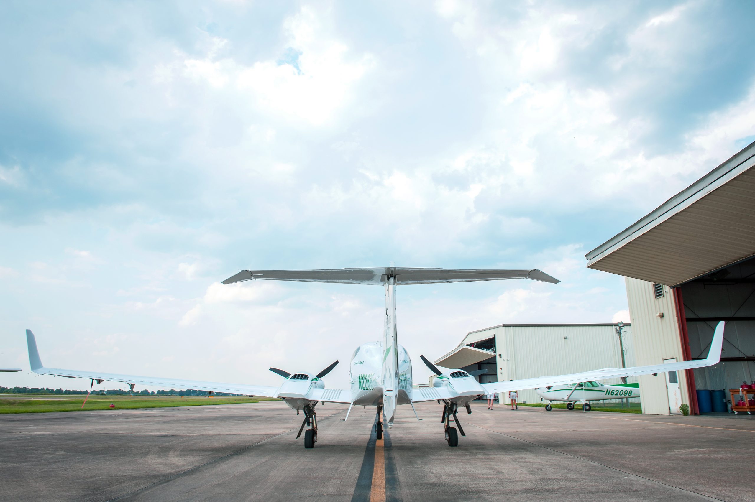 Delta State plan on runway near airport hanger.