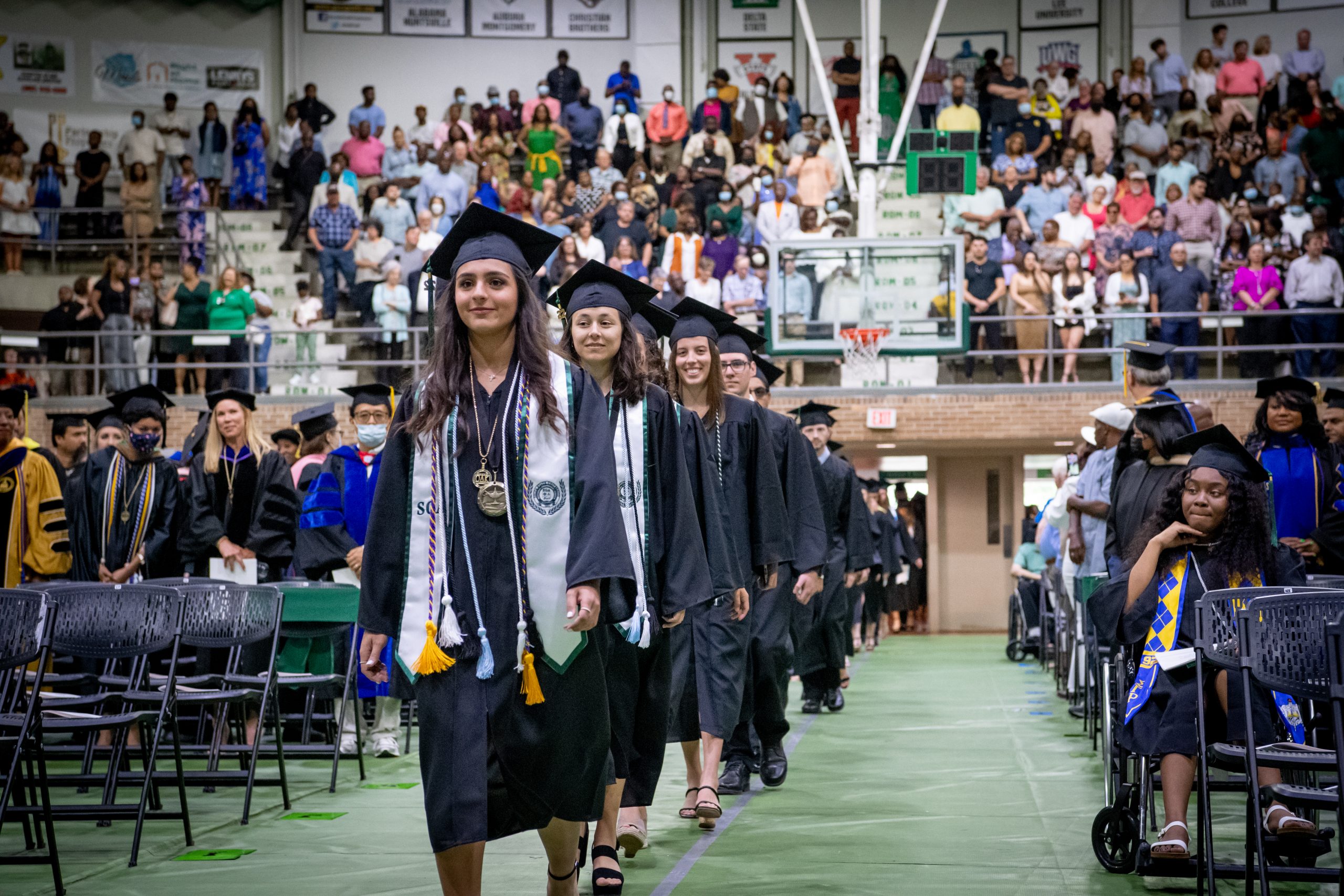 Students entering coliseum for commencement ceremony.