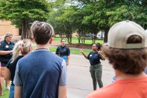 Students on a guided Delta State University Campus Tour with admissions recruiter.