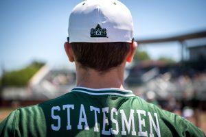 Delta State Baseball player with Statesmen Jersey and Delta State Athletics hat.