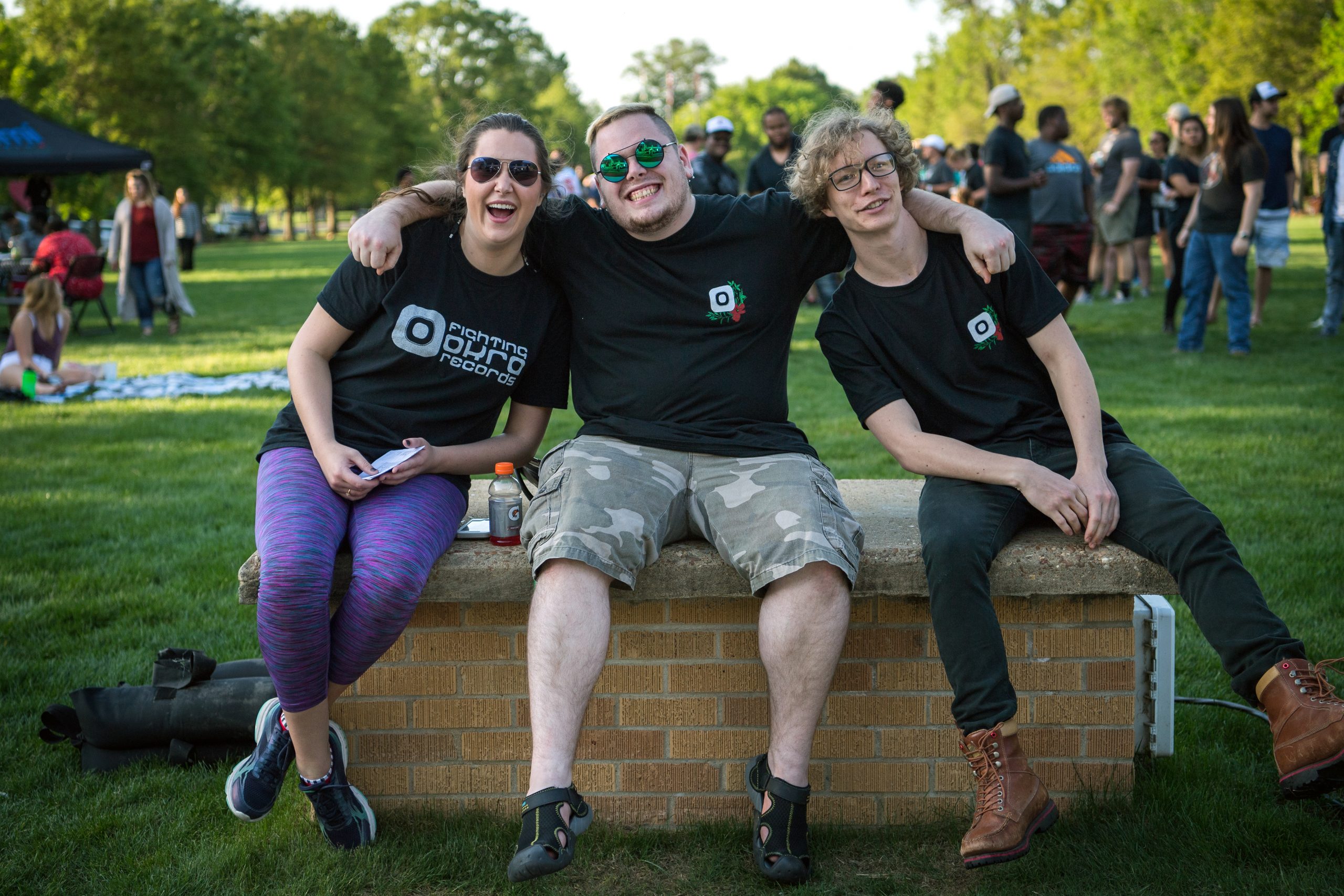 3 students at fighting okra records event on the Quad.