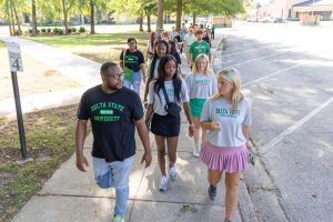 Prospective students touring the Delta State University campus with a guide.