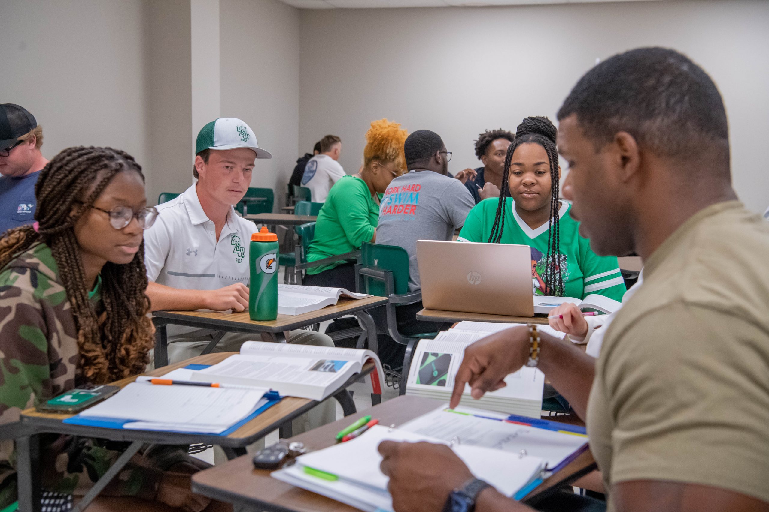 Students participating in group work in a classroom setting.