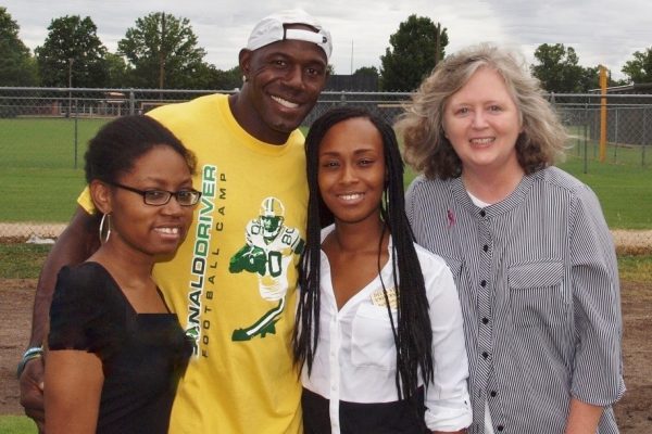 The purpose of this partnership was to promote breast cancer awareness at the Donald Driver Football Camp on June 26, 2014 at Cleveland High School. Camp participants wore pink Running Komen ribbons on the camp t-shirts. Pictured: Sharon Grose, Donald Driver, Aubreisha Hackler, and Gail Bailey.