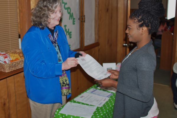 Gail Bailey, Project Coordinator for the Breast Education and Early-detection Project at Delta State discusses the importance of early detection with a participant at health fair at Cornerstone Church on March 28, 2015 in Cleveland, MS.