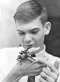 student holding spider