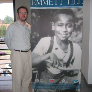 Man standing next to display in Emmett Till Traveling Exhibit