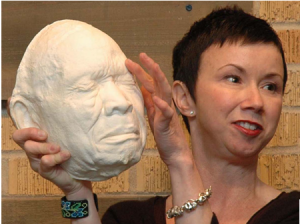Sharon McConnell holding a blues artist cast
