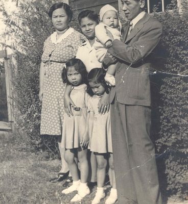 Family psoing for photo, B&W.