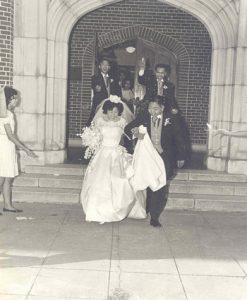 Bride and groom leaving a church after they married, B&W.