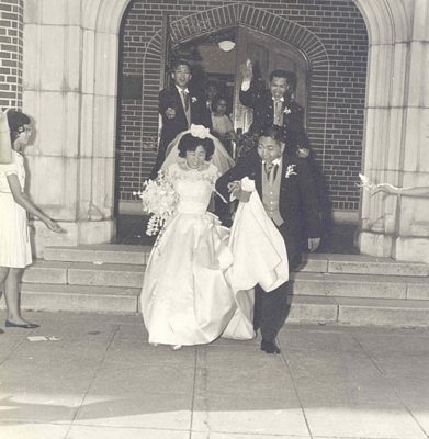 Bride and groom leaving a church after they married, B&W.