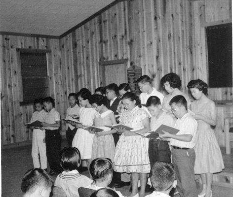 Children singing in choir, B&W.