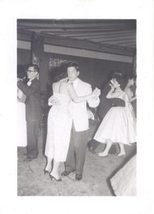 Man and woman dancing at social, B&W.