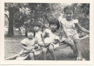 4 children on log, B&W.