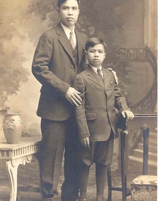 Man and child posing for portrait, B&W.