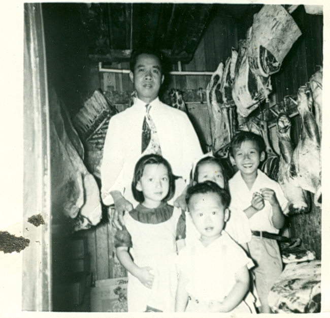 Family poses in their store.