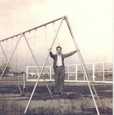 Man standing on swing, B&W.