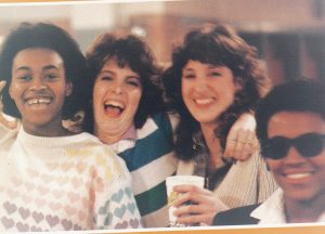 Four students laughing together, 1980.