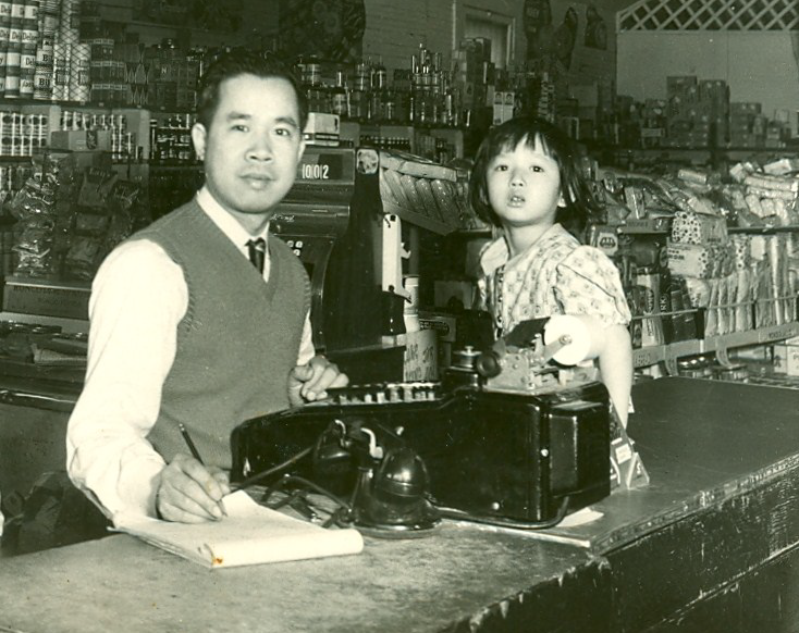 Man and young girl at register.