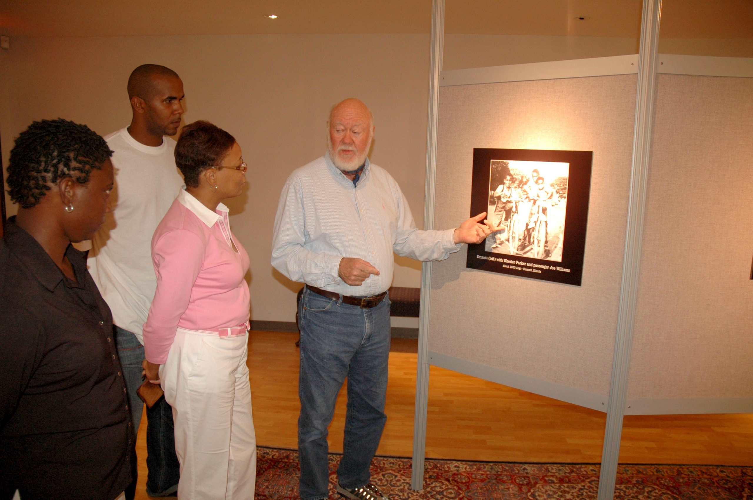 Dr. Henry Outlaw explaining a panel.