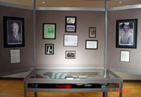 Presidential memorabilia with photographs in background