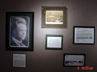 Wall of photographs and memorabilia