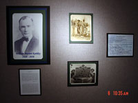 Presidential memoribilia and photos mounted on wall.
