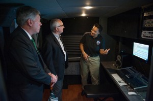 Jackson (left) shows Pittman (center) and President LaForge the fully-equipped DMI Mobile Music Lab.