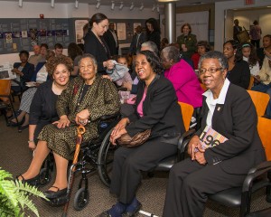 Alysia Burton Steele (from left) poses with Annyce Campbell of Mound Bayou, who is featured on the cover of Steele's book "Delta Jewels: In Search of My Grandmother's Wisodom." Seated next to Campbell are her daughters Alma Campbell and Emily Harris, also of Mound Bayou.