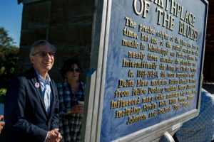 National Endowment for the Humanities chairman Bro Adams views the blues marker at Dockery Farms during a recent visit to the Mississippi Delta.