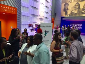 Attendees linger in the lobby of the museum and visit with the musicians following the performance.