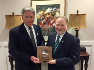 President LaForge (left) and Dr. McAdams with the centennial gift from Perm State University.